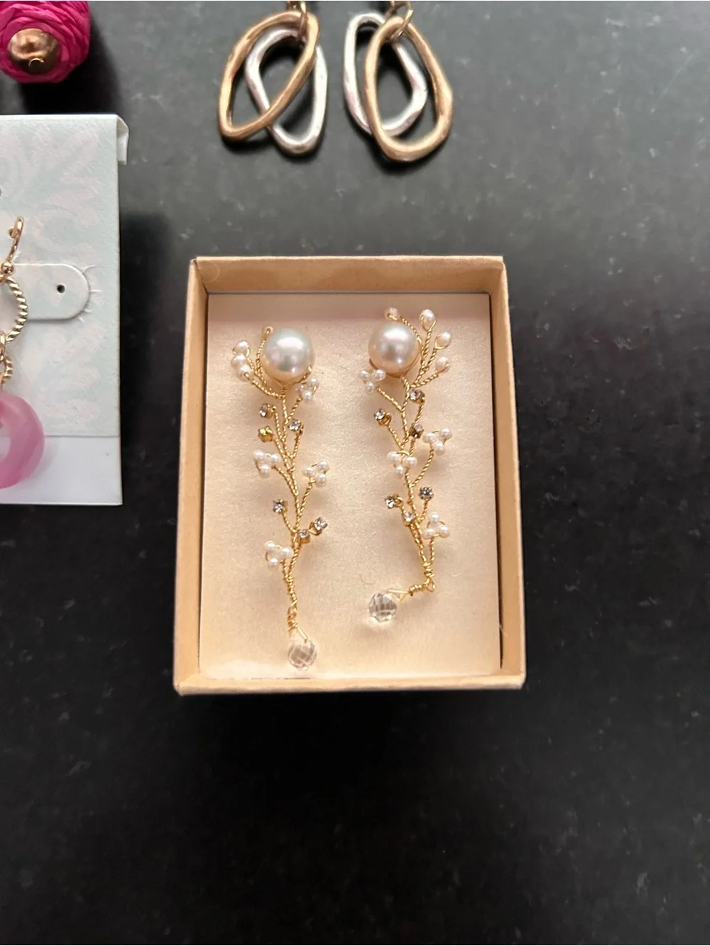 7 pair pierced earrings, drop style, most never worn, gold tone metals.